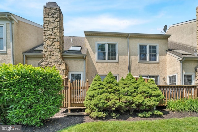 1305 Halifax Ct Unit 1305, West Chester, PA 19382 - view of front of home featuring stucco siding and a chimney