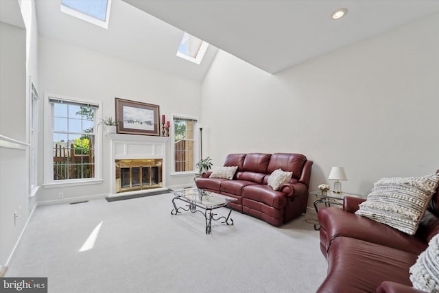 1305 Halifax Ct Unit 1305, West Chester, PA 19382 - living area featuring a skylight, high vaulted ceiling, carpet flooring, a fireplace with flush hearth, and recessed lighting