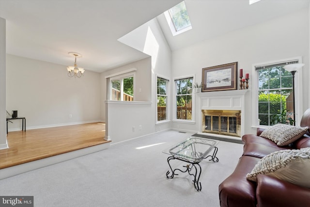 1305 Halifax Ct Unit 1305, West Chester, PA 19382 - carpeted living area with a fireplace with flush hearth, a chandelier, and a skylight