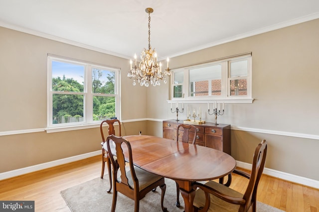 3917 Fessenden St NW, Washington, DC 20016 - dining room with light wood finished floors, a chandelier, and crown molding