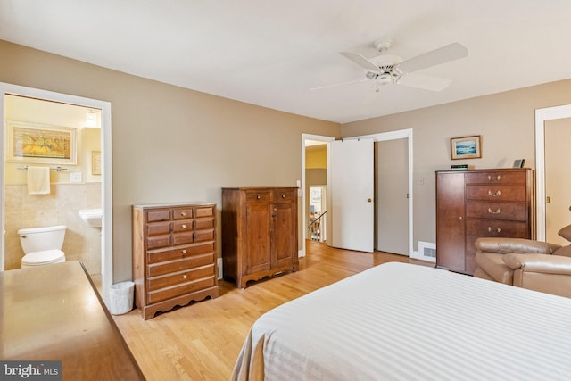 3917 Fessenden St NW, Washington, DC 20016 - bedroom with light wood-type flooring, ensuite bathroom, ceiling fan, and a closet
