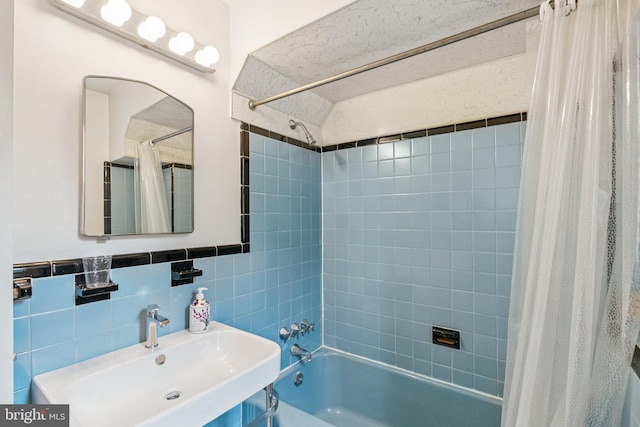 3917 Fessenden St NW, Washington, DC 20016 - bathroom featuring shower / bathtub combination with curtain and tile walls