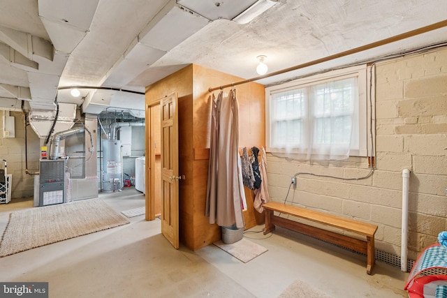 3917 Fessenden St NW, Washington, DC 20016 - below grade area featuring water heater, concrete block wall, washer / clothes dryer, and heating unit