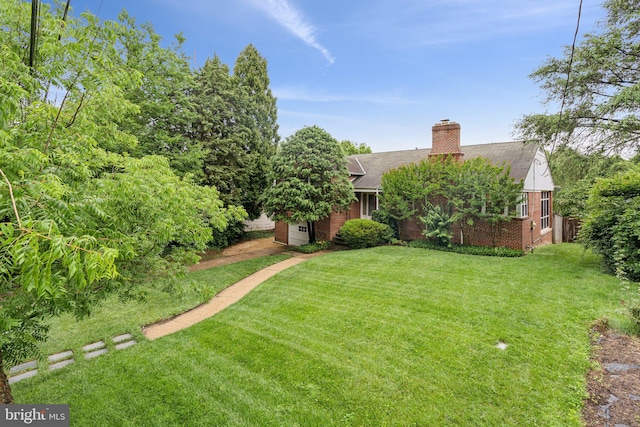 3917 Fessenden St NW, Washington, DC 20016 - view of front of property with brick siding, a front lawn, a chimney, and a shingled roof