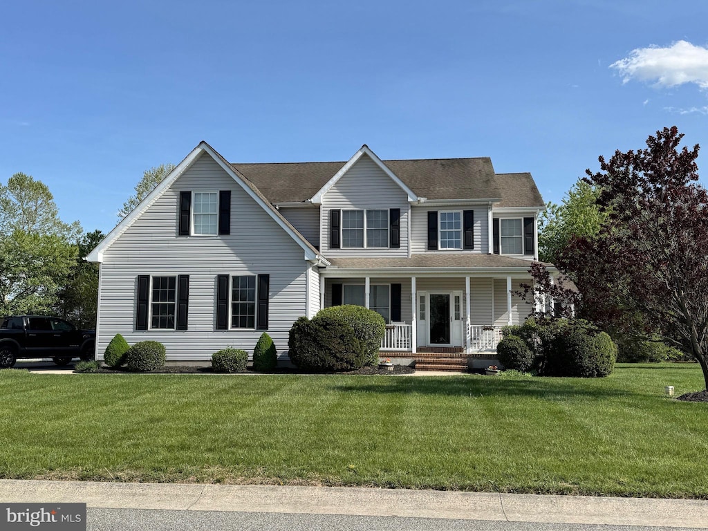 334 Ashland Ave, Camden Wyoming, DE 19934 - view of front facade featuring a porch and a front yard