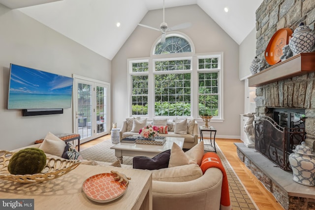 10 Callery Way, Malvern, PA 19355 - living area featuring high vaulted ceiling, wood finished floors, a ceiling fan, a stone fireplace, and recessed lighting
