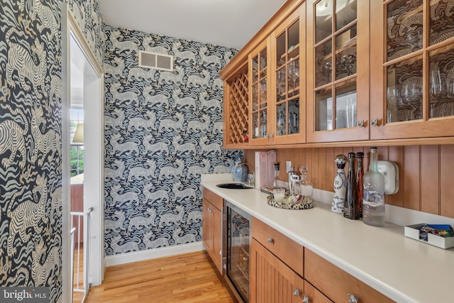 10 Callery Way, Malvern, PA 19355 - bar area with wallpapered walls, beverage cooler, and light wood-style floors