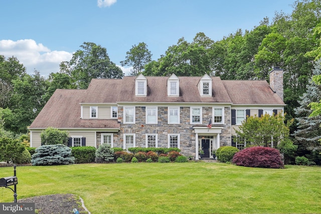 10 Callery Way, Malvern, PA 19355 - view of front of home featuring stone siding, a front yard, and a chimney