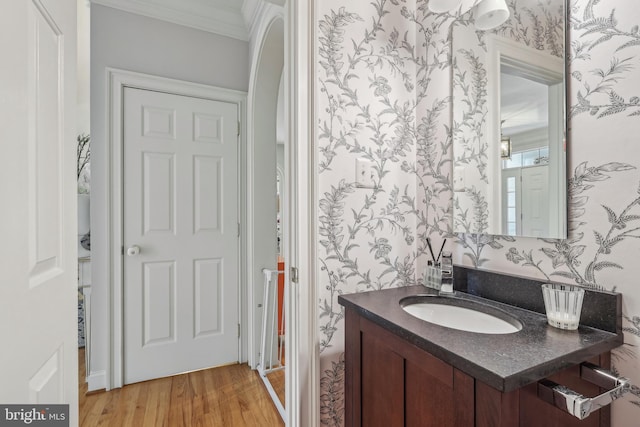 10 Callery Way, Malvern, PA 19355 - bathroom featuring ornamental molding, vanity, wood finished floors, and wallpapered walls