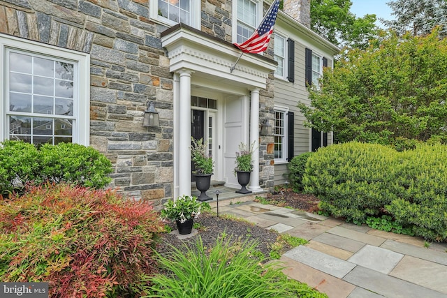 10 Callery Way, Malvern, PA 19355 - property entrance with stone siding and a chimney