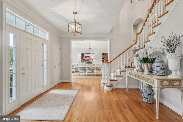 10 Callery Way, Malvern, PA 19355 - foyer with stairs, a chandelier, wood finished floors, and ornamental molding