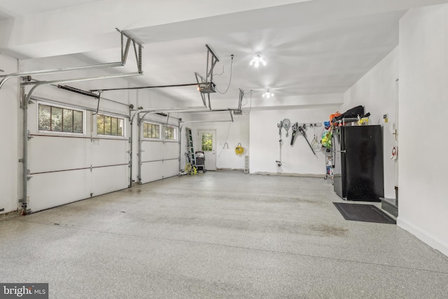 10 Callery Way, Malvern, PA 19355 - garage featuring freestanding refrigerator and a garage door opener