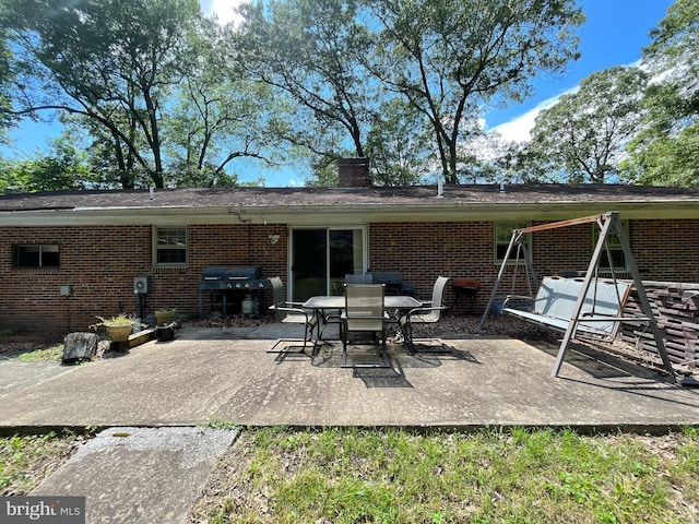 14102 Gibbons Church Rd, Brandywine, MD 20613 - back of house with brick siding, a patio area, and a chimney