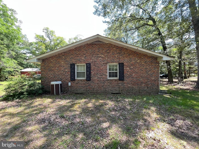 14102 Gibbons Church Rd, Brandywine, MD 20613 - view of home's exterior with brick siding and a central AC unit