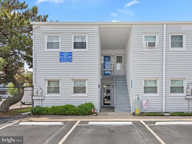 2701 Sparrow Ln Unit 1, Ocean City, MD 21842 - view of building exterior featuring uncovered parking, cooling unit, and stairs