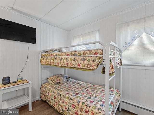 2701 Sparrow Ln Unit 1, Ocean City, MD 21842 - bedroom with a baseboard heating unit and wood finished floors
