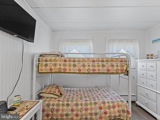 2701 Sparrow Ln Unit 1, Ocean City, MD 21842 - bedroom featuring multiple windows, dark wood-style floors, and a baseboard radiator