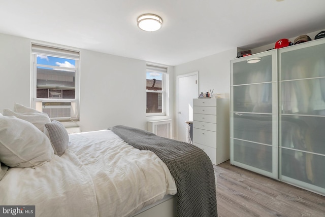 2229 S Darien St, Philadelphia, PA 19148 - bedroom with wood finished floors, multiple windows, and cooling unit