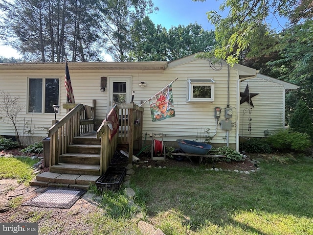 242 Center Rd, Elmer, NJ 08318 - view of front of property with a front lawn and a deck
