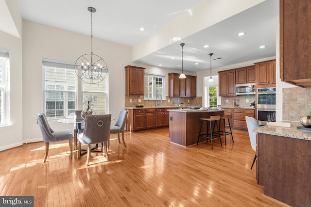 4509 Rhett Ln, Fairfax, VA 22030 - dining room featuring light wood-style flooring, a chandelier, and recessed lighting