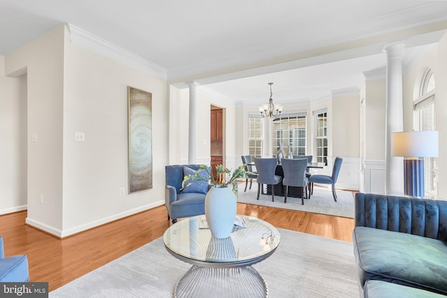4509 Rhett Ln, Fairfax, VA 22030 - living area with a chandelier, ornamental molding, decorative columns, and wood finished floors