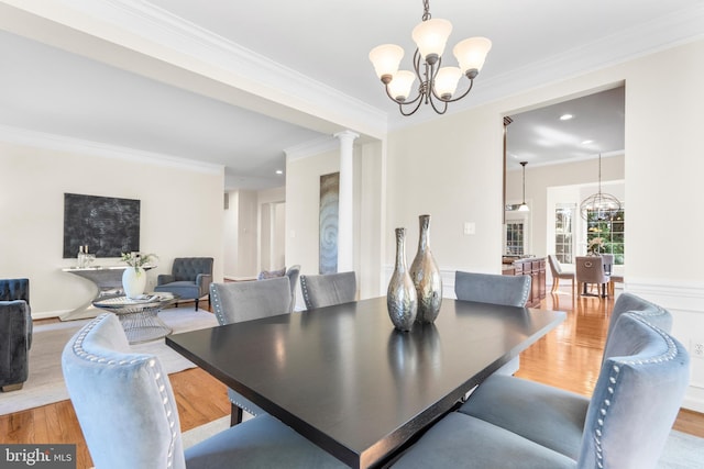 4509 Rhett Ln, Fairfax, VA 22030 - dining space with a chandelier, wood finished floors, ornamental molding, decorative columns, and recessed lighting