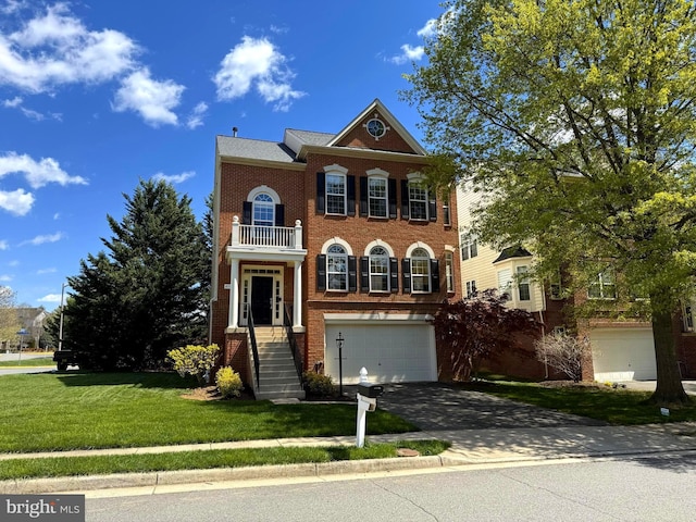 4509 Rhett Ln, Fairfax, VA 22030 - colonial home featuring a garage, a balcony, asphalt driveway, a front yard, and brick siding