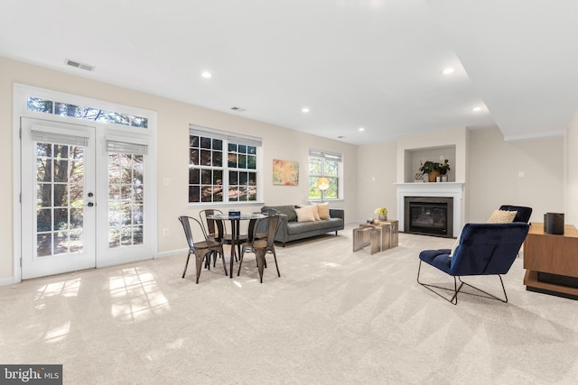 4509 Rhett Ln, Fairfax, VA 22030 - living area featuring carpet flooring, a fireplace with flush hearth, recessed lighting, and french doors