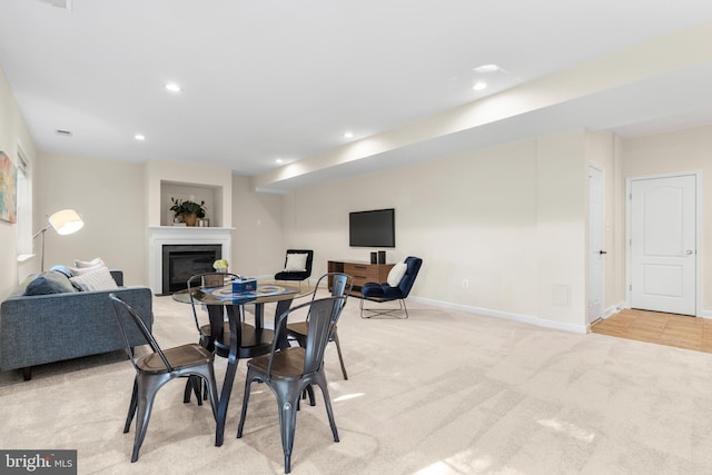 4509 Rhett Ln, Fairfax, VA 22030 - dining area featuring light colored carpet, a glass covered fireplace, and recessed lighting