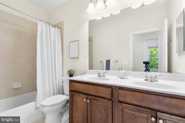 4509 Rhett Ln, Fairfax, VA 22030 - full bathroom with double vanity, shower / bath combo with shower curtain, and tile patterned floors