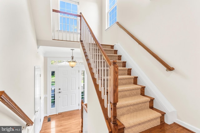 4509 Rhett Ln, Fairfax, VA 22030 - entrance foyer featuring a towering ceiling, light wood finished floors, and stairway