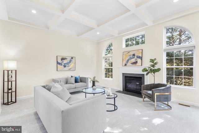 4509 Rhett Ln, Fairfax, VA 22030 - carpeted living room featuring coffered ceiling, beamed ceiling, a fireplace with flush hearth, healthy amount of natural light, and recessed lighting