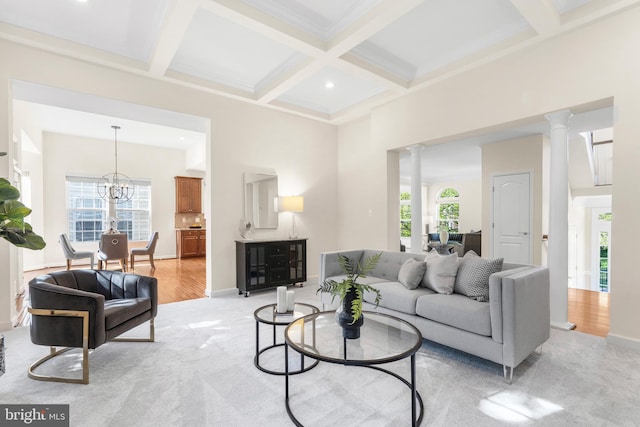 4509 Rhett Ln, Fairfax, VA 22030 - living area featuring ornate columns, beam ceiling, coffered ceiling, a chandelier, and light carpet