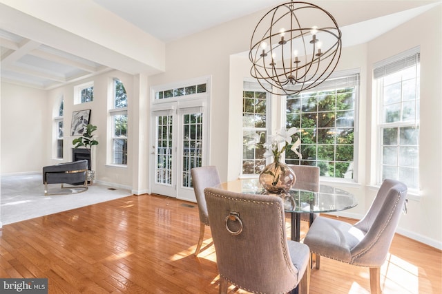 4509 Rhett Ln, Fairfax, VA 22030 - dining area with a chandelier, plenty of natural light, wood-type flooring, beamed ceiling, and a fireplace