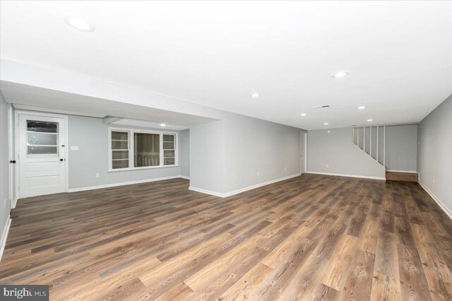 7533 Dover Ln, Lanham, MD 20706 - unfurnished living room featuring wood finished floors, recessed lighting, and stairway