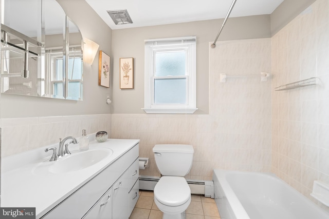 532 Wicker Ave, Bensalem, PA 19020 - full bath with vanity, a baseboard radiator, tile patterned floors, tile walls, and washtub / shower combination