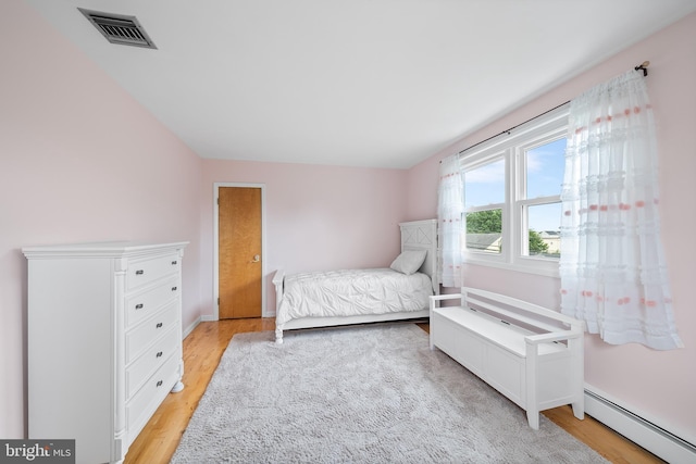 532 Wicker Ave, Bensalem, PA 19020 - bedroom with a baseboard radiator and light wood finished floors