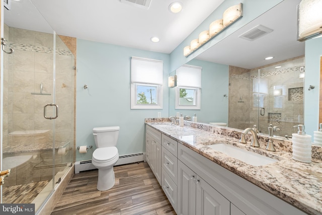 532 Wicker Ave, Bensalem, PA 19020 - bathroom featuring double vanity, wood finished floors, a stall shower, a baseboard radiator, and recessed lighting