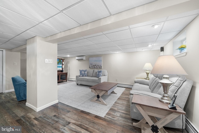 532 Wicker Ave, Bensalem, PA 19020 - living area featuring a wall mounted AC, a paneled ceiling, a baseboard radiator, wood finished floors, and recessed lighting