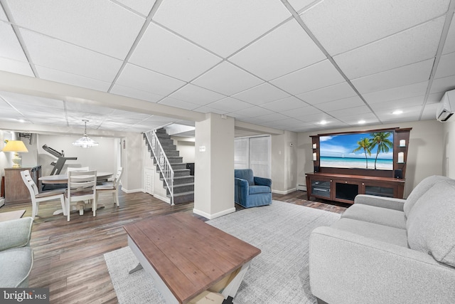 532 Wicker Ave, Bensalem, PA 19020 - living room with stairway, wood finished floors, a drop ceiling, recessed lighting, and a baseboard heating unit