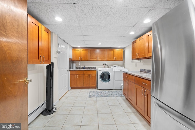 532 Wicker Ave, Bensalem, PA 19020 - laundry area with baseboard heating, washer and dryer, cabinet space, light tile patterned flooring, and recessed lighting