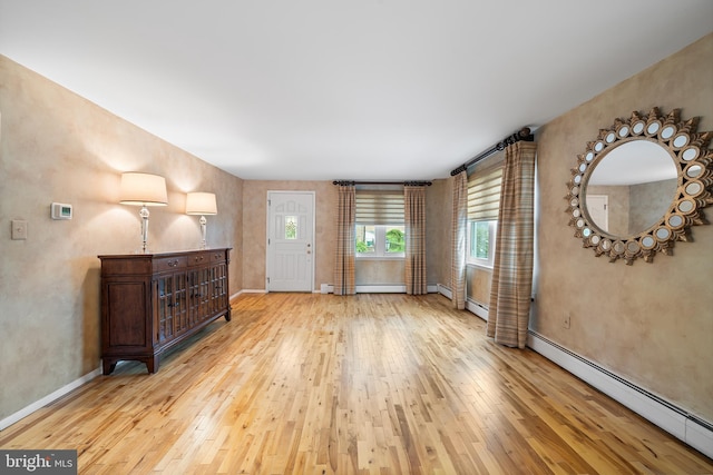 532 Wicker Ave, Bensalem, PA 19020 - unfurnished living room with a baseboard heating unit and light wood-type flooring
