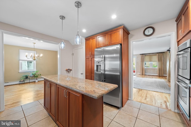 532 Wicker Ave, Bensalem, PA 19020 - kitchen with stainless steel appliances, a baseboard radiator, a kitchen island, light tile patterned floors, and light stone counters