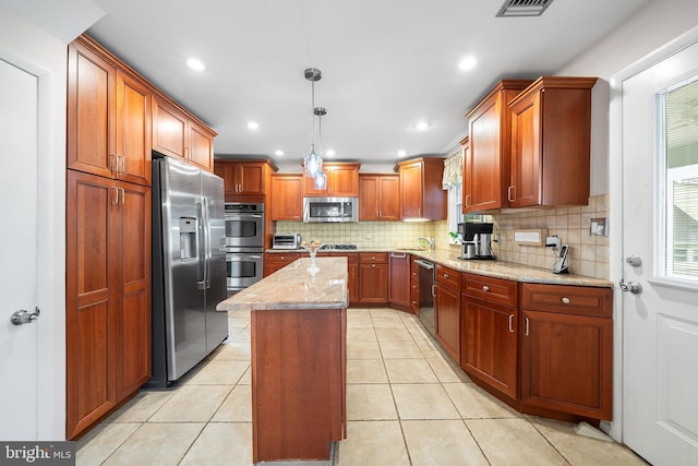 532 Wicker Ave, Bensalem, PA 19020 - kitchen with appliances with stainless steel finishes, decorative backsplash, light stone countertops, a kitchen island, and recessed lighting