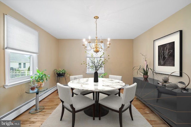 532 Wicker Ave, Bensalem, PA 19020 - dining space featuring light wood-type flooring, a chandelier, and a baseboard heating unit