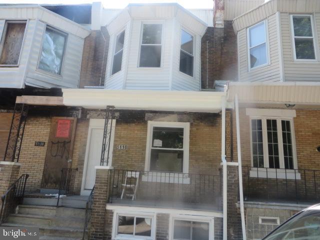 5110 Parrish St, Philadelphia, PA 19139 - view of front of property with brick siding and covered porch