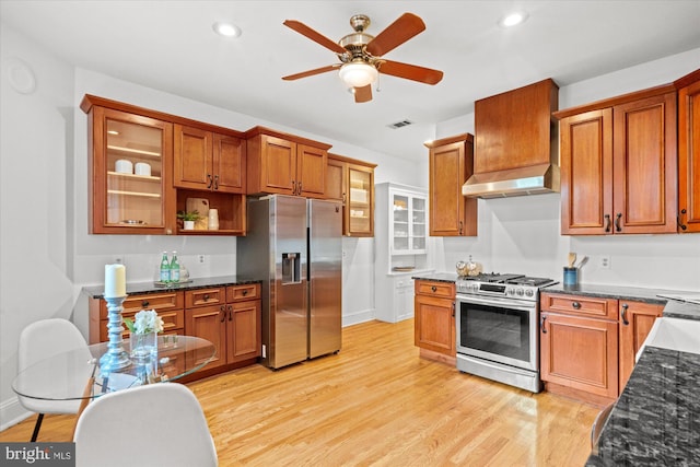 2637 Garfield St NW, Washington, DC 20008 - kitchen with appliances with stainless steel finishes, light wood-type flooring, brown cabinetry, a ceiling fan, and recessed lighting