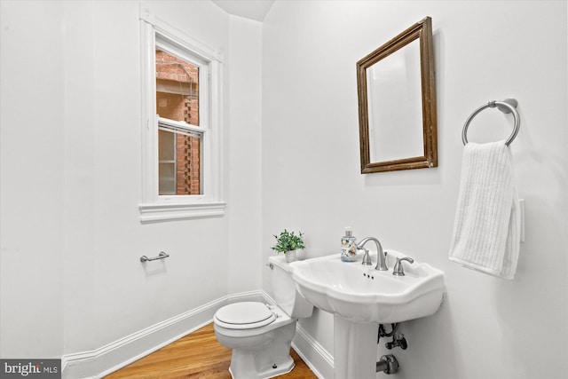 2637 Garfield St NW, Washington, DC 20008 - half bathroom featuring baseboards and wood finished floors
