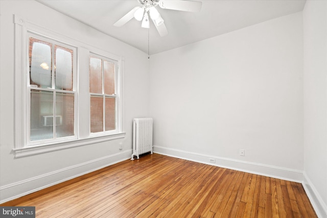 2637 Garfield St NW, Washington, DC 20008 - spare room with radiator heating unit, light wood finished floors, and a ceiling fan