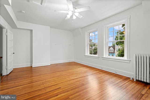 2637 Garfield St NW, Washington, DC 20008 - unfurnished room featuring radiator heating unit, light wood-style floors, a smoke detector, and ceiling fan